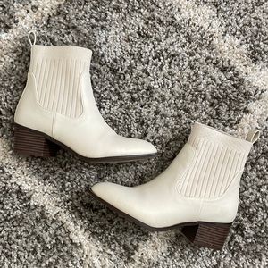 Heeled white booties